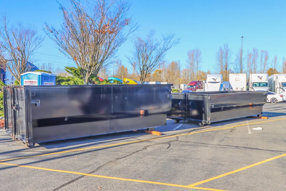 Professional dumpster rental service with roll-off container on residential driveway in Cortlandt